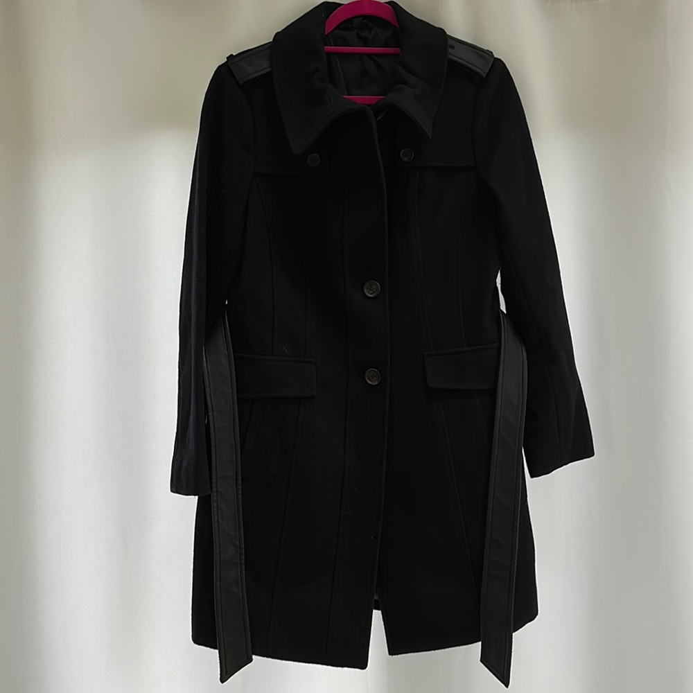 Silk lined wool trench coat with leather trim details on shoulders and belt